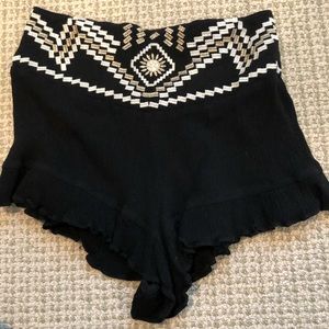 Black flowy shorts with designs
